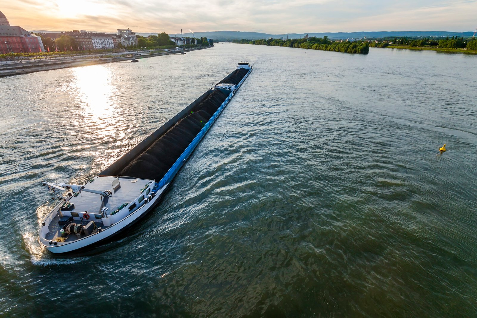 Cargo ship with coal bulk load on the river Rhine in Mainz, Germany