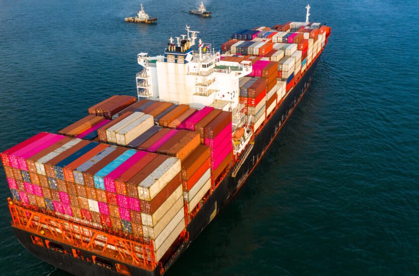 Aerial view container ship carrying container in import export b